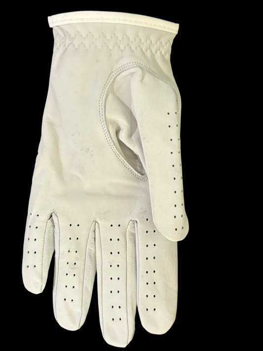 White leather glove on a black background