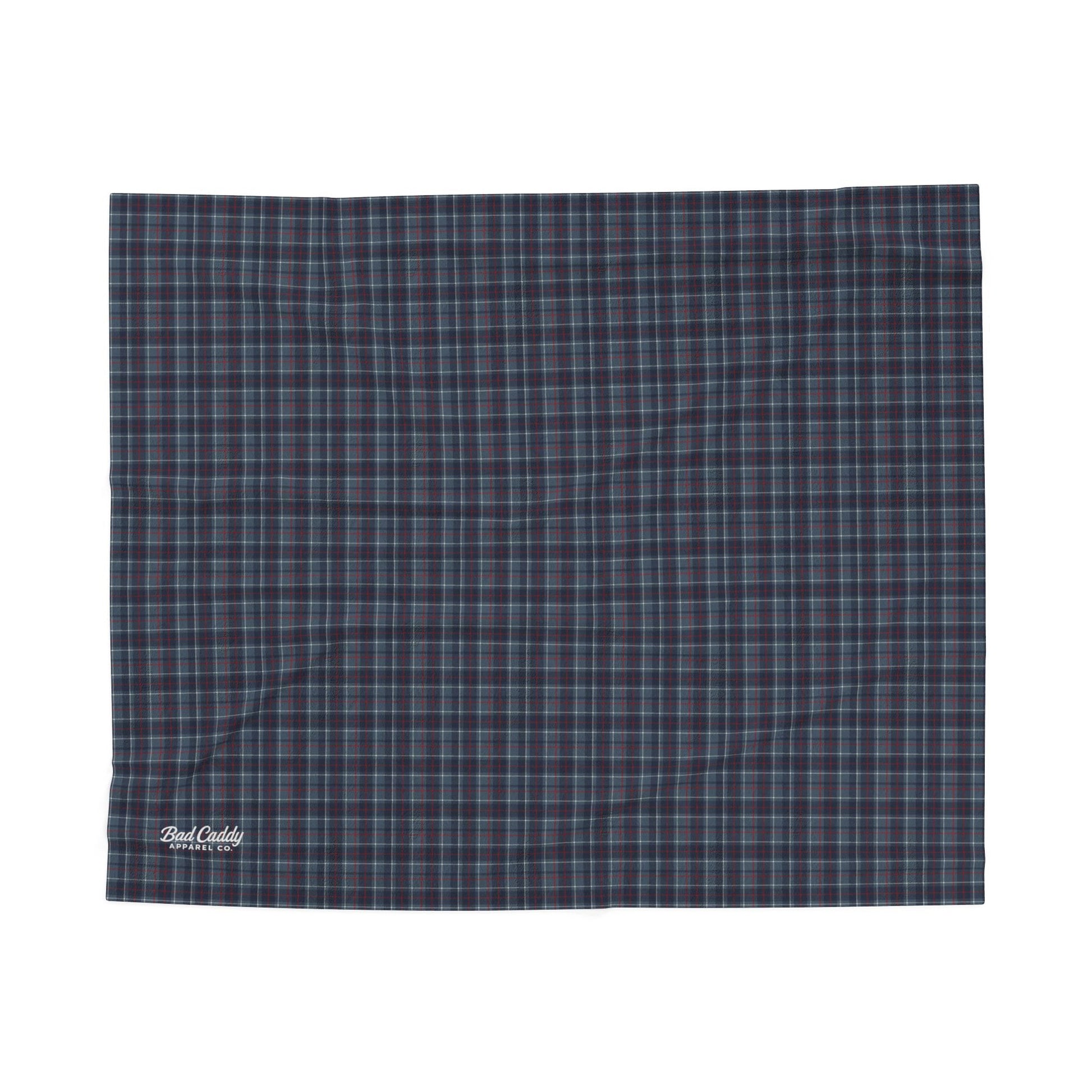 Plaid blanket with a visible brand logo on a white background