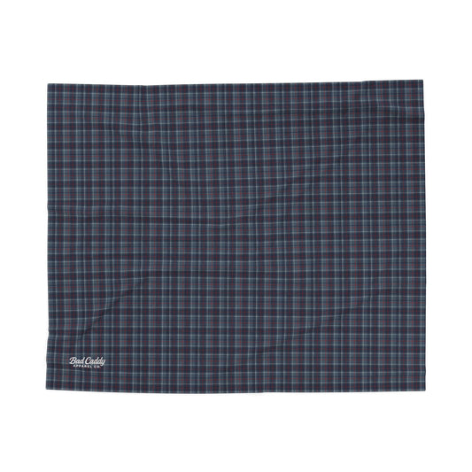 Plaid blanket with a visible brand logo on a white background