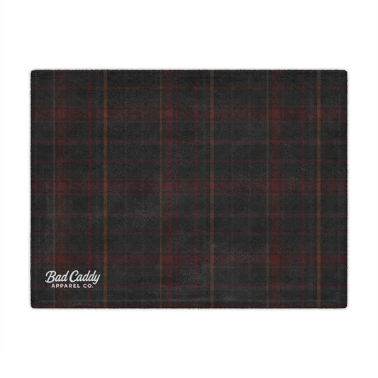 Black and red plaid fabric with 'Bad Caddy Apparel Co.' logo on a white background